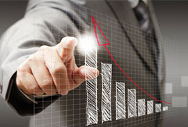 A businessman in a suit pointing at a glowing growth chart with an upward trend.
