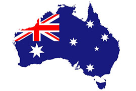 Map of Australia filled with the Australian flag against a white background.