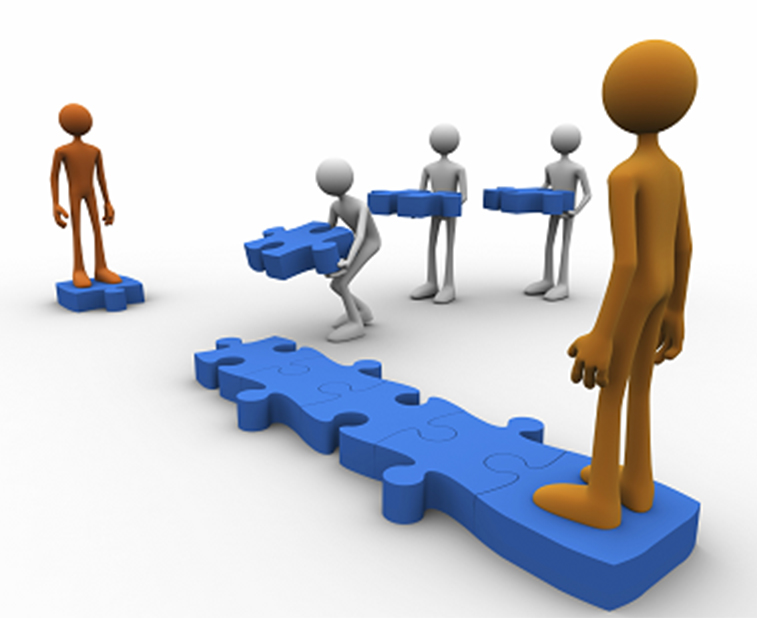 An orange 3D figure stands at one end of a blue puzzle-piece bridge, watching three gray figures carry puzzle pieces to complete the path.