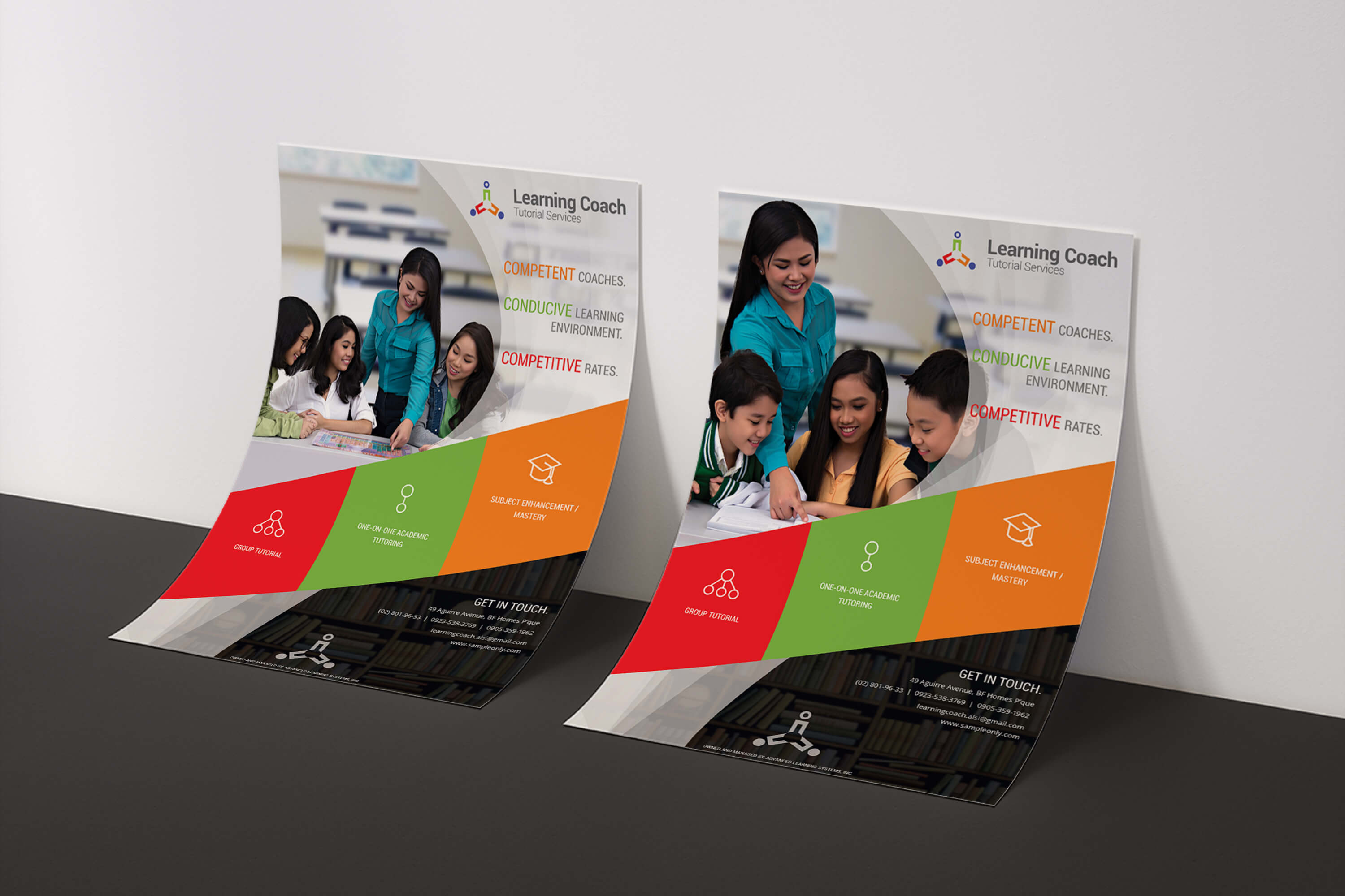 Two identical brochures for Learning Coach Tutorial Services, leaning against a white wall, featuring photos of tutors with students, color-blocked sections in red, green, and orange, and contact information at the bottom.