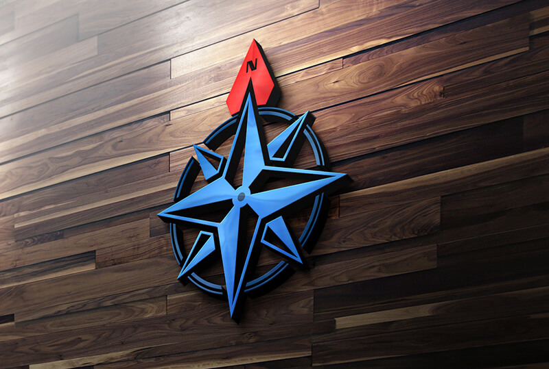 A 3D compass rose logo with a blue star and a red northern point, mounted on a wood-paneled wall.