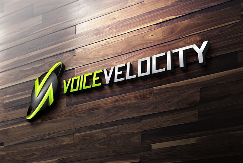 The 3D logo for Voice Velocity, featuring silver and green lettering and a circular icon, is mounted on a dark wooden wall.