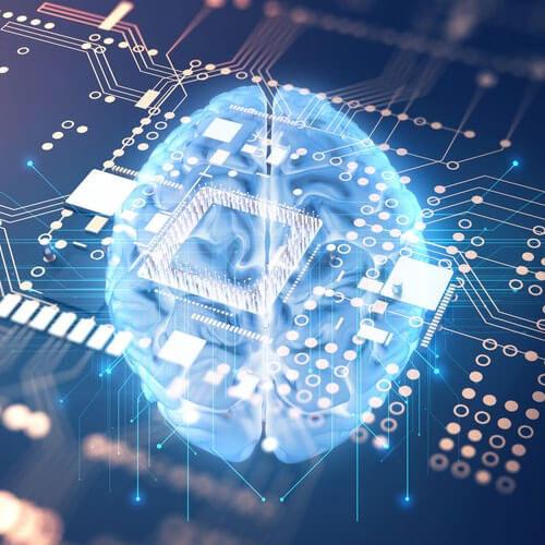 A glowing, translucent blue human brain is integrated with a complex computer circuit board, representing artificial intelligence and neuroscience.