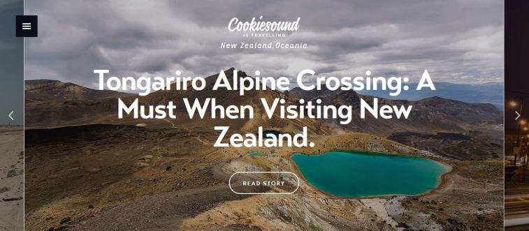 A blog post banner featuring the text "Tongariro Alpine Crossing: A Must When Visiting New Zealand" over a scenic aerial view of volcanic mountains and an emerald lake.