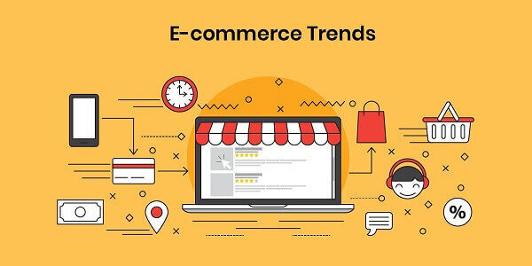 An illustrated banner on a yellow background with the title E-commerce Trends shows a laptop with a storefront awning above the screen, surrounded by icons for mobile shopping, payment, delivery, support, and discounts.