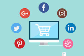 A computer monitor with a shopping cart on screen, surrounded by various social media and internet icons.