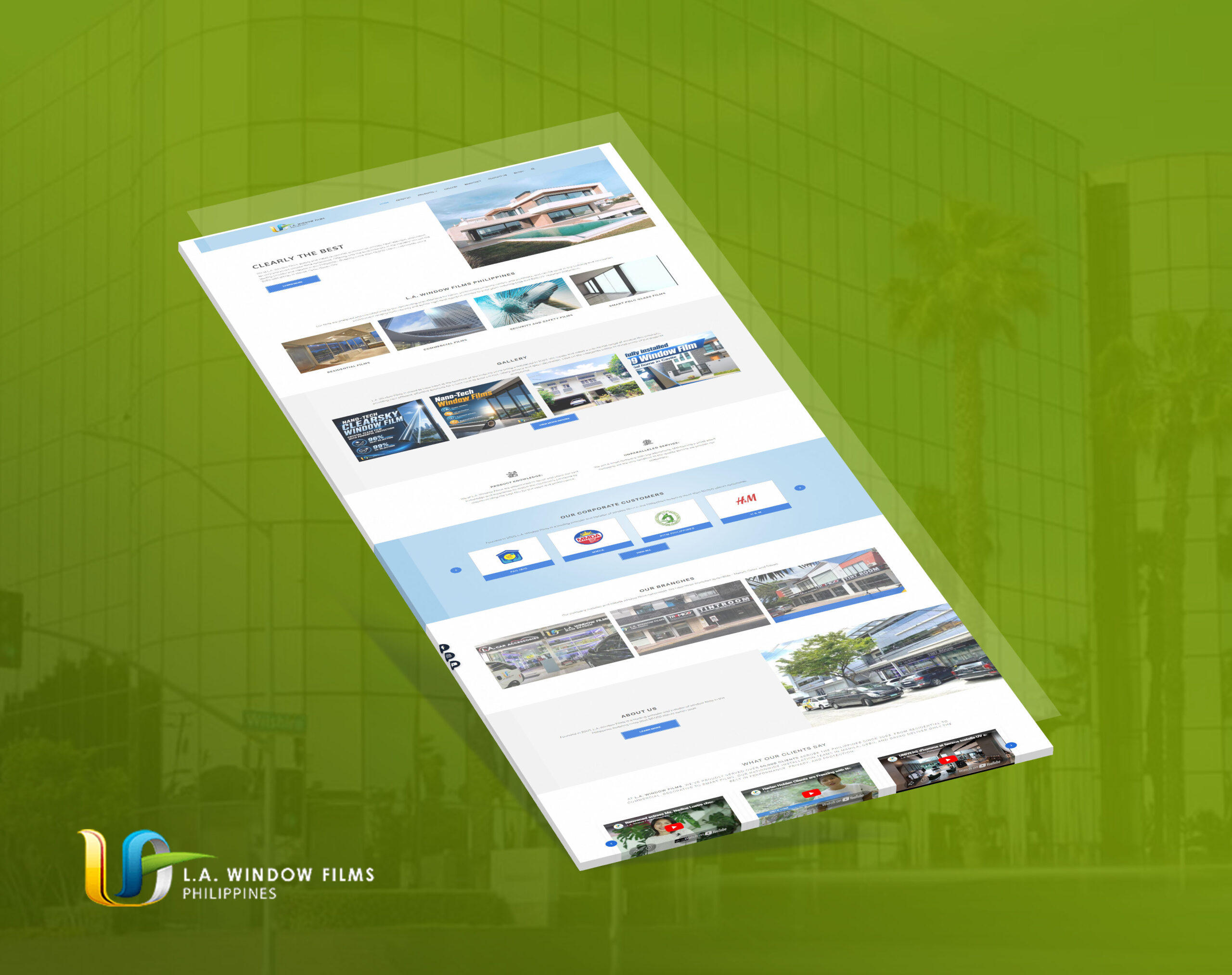 A tilted 3D mockup of the L.A. Window Films Philippines website, set against a green building background.