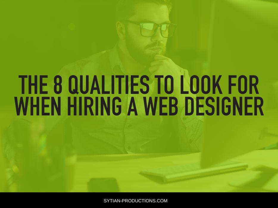 A bearded man in glasses works at a desk, with green-tinted overlay text that reads The 8 Qualities to Look for When Hiring a Web Designer.