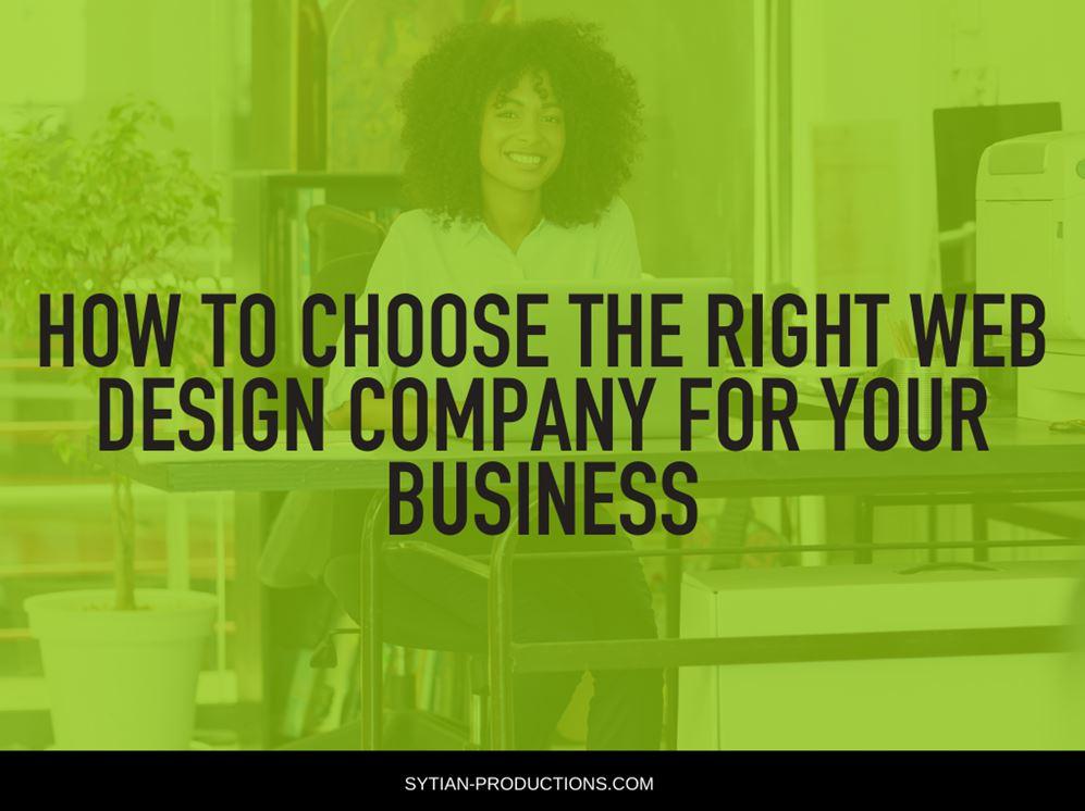 A smiling woman with curly hair sits at her desk in a modern office, overlaid with green tint and the title How to Choose the Right Web Design Company for your Business.