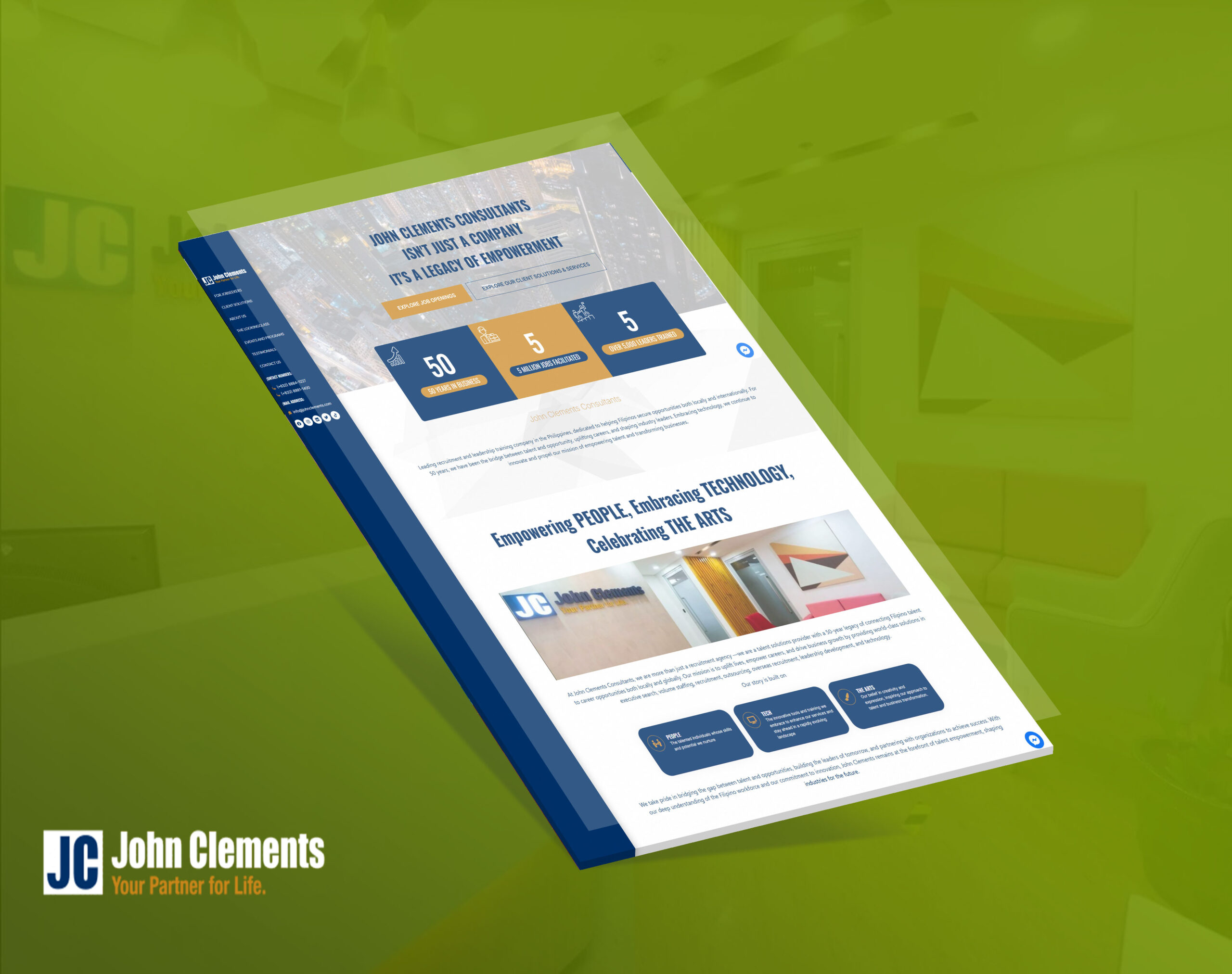 An angled mockup of the John Clements website homepage, featuring the tagline "Empowering PEOPLE, Embracing TECHNOLOGY, Celebrating THE ARTS" and company statistics against a bright green background.